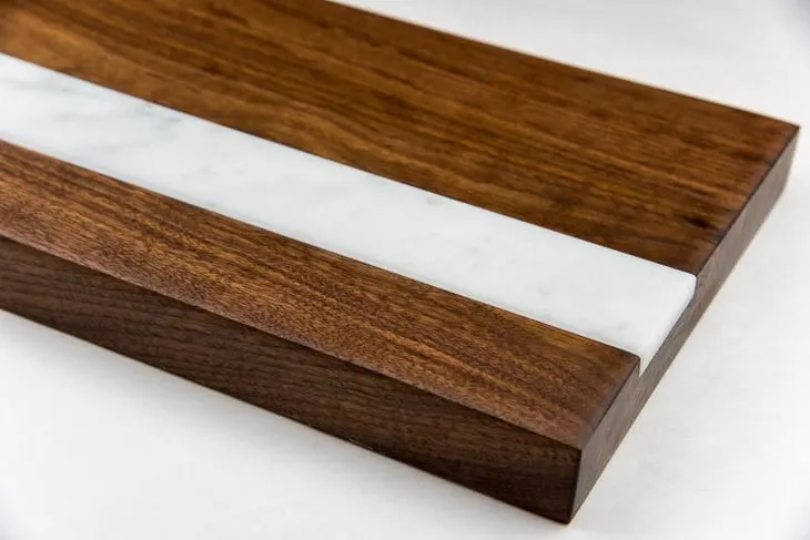 walnut cutting board with marble inlay