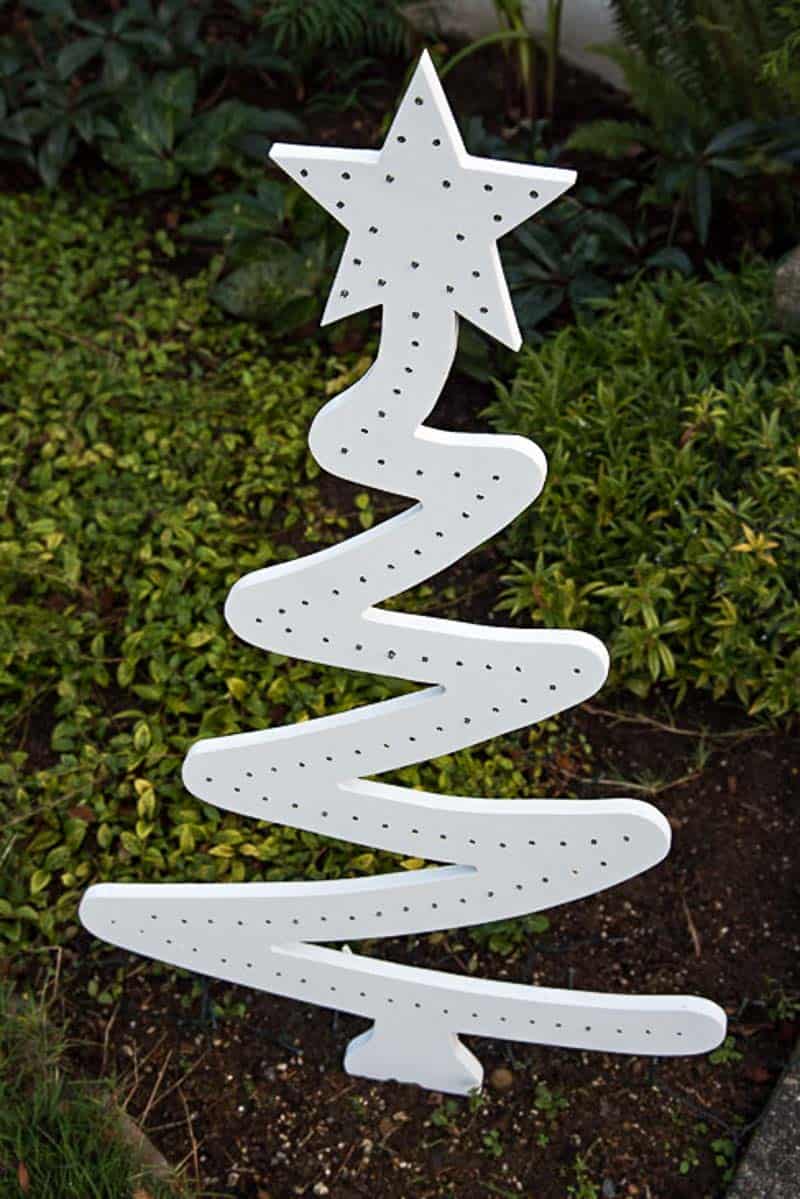 white DIY wooden Christmas tree in garden during the day