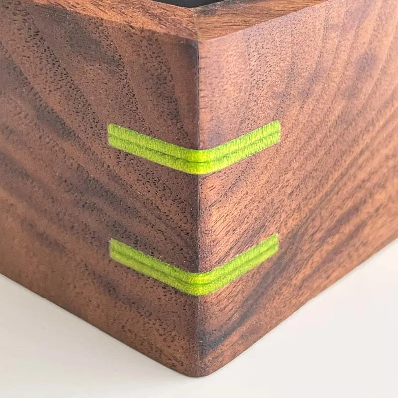 walnut box with mitered corner and green veneer splines