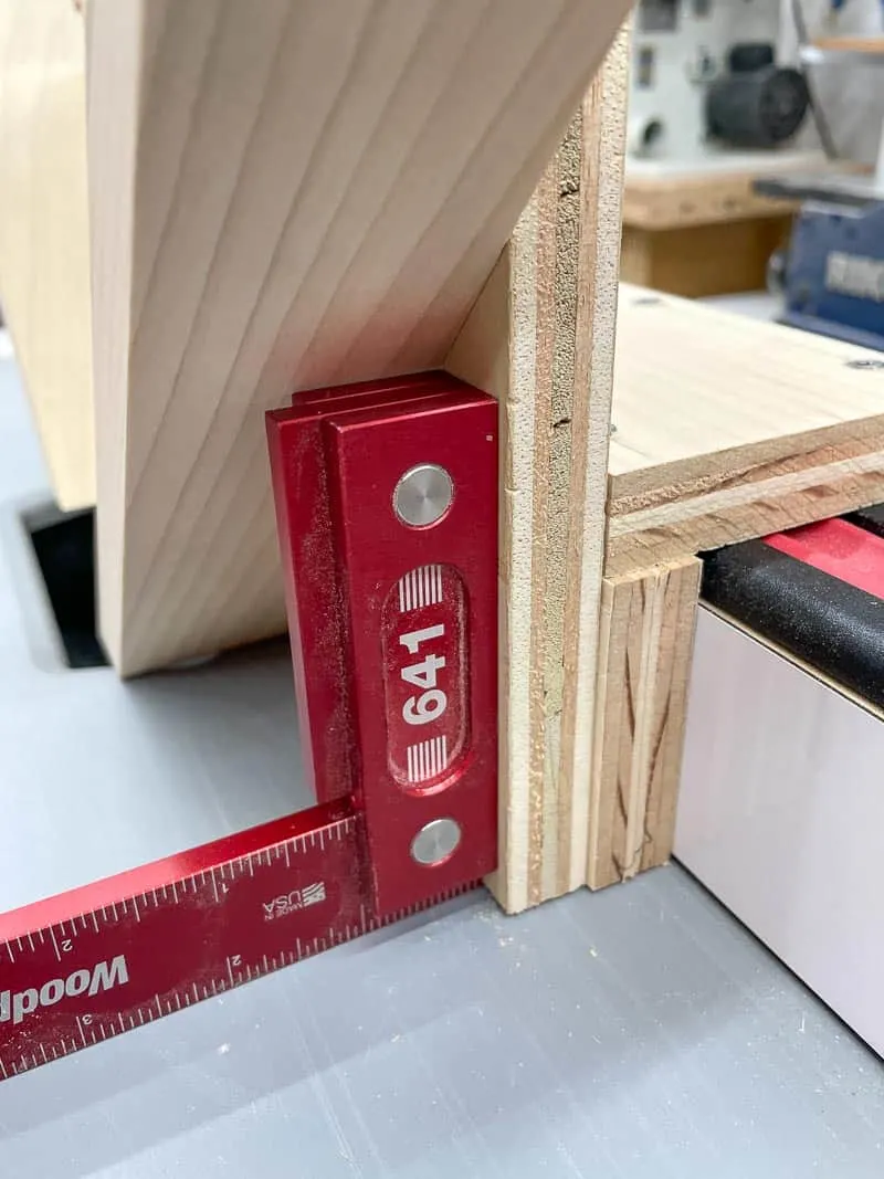 checking the spline jig for square on the table saw