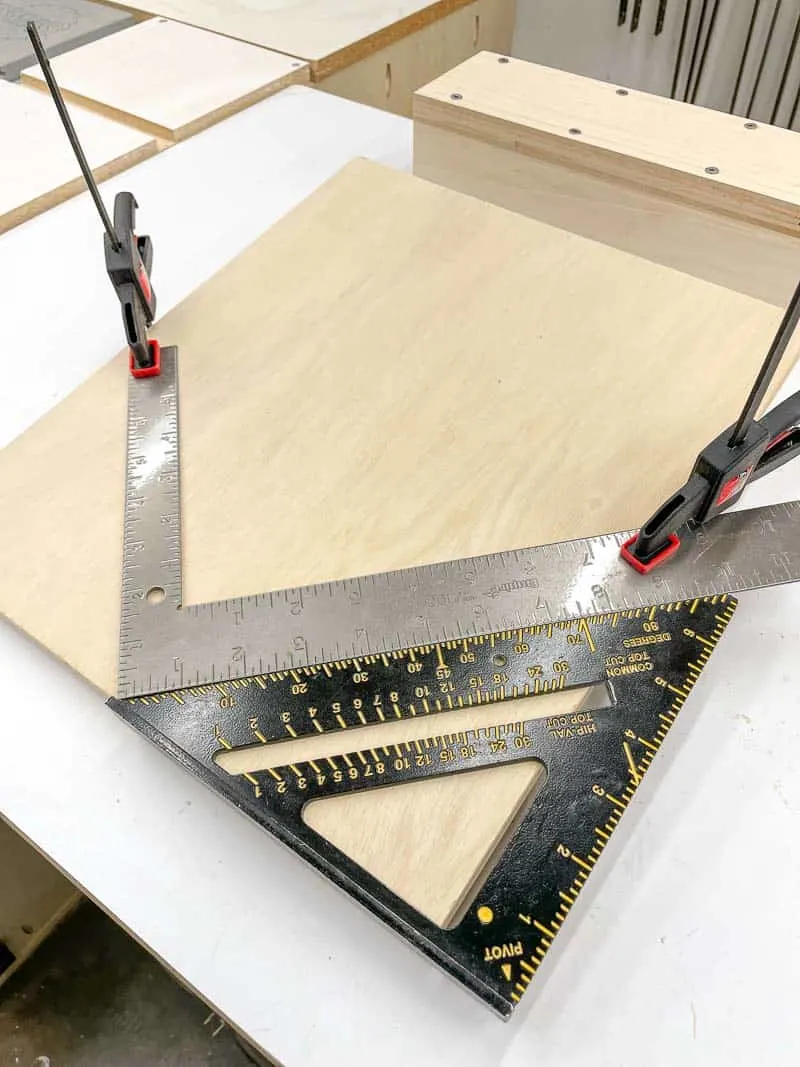 framing square and speed square being used to get a perfect 90 degree angle on a spline jig