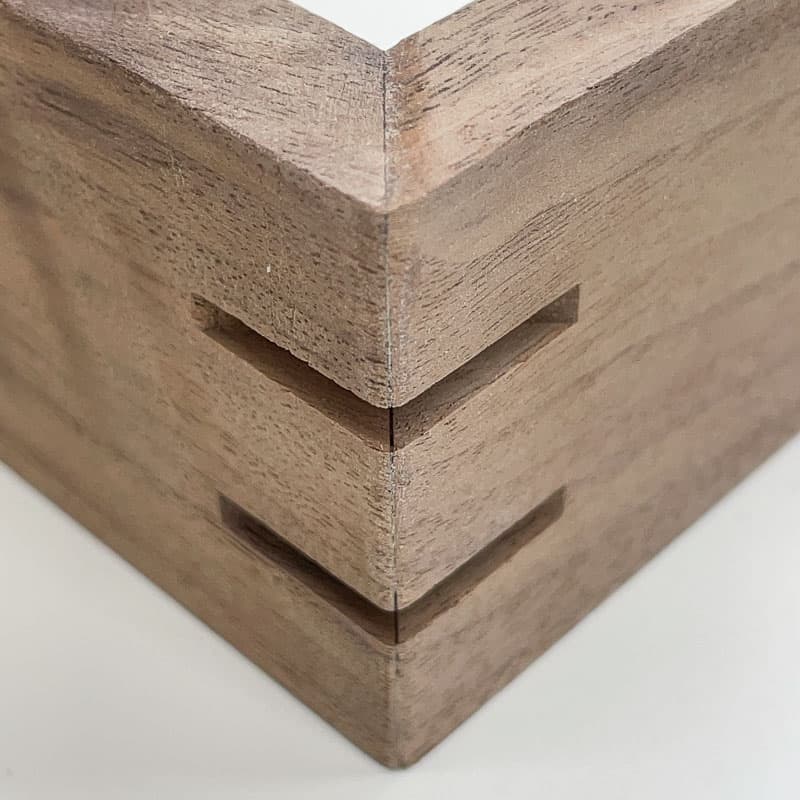 grooves cut in mitered corners for splines