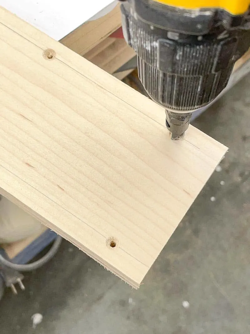 drilling countersink holes along the top of the spline jig saddle