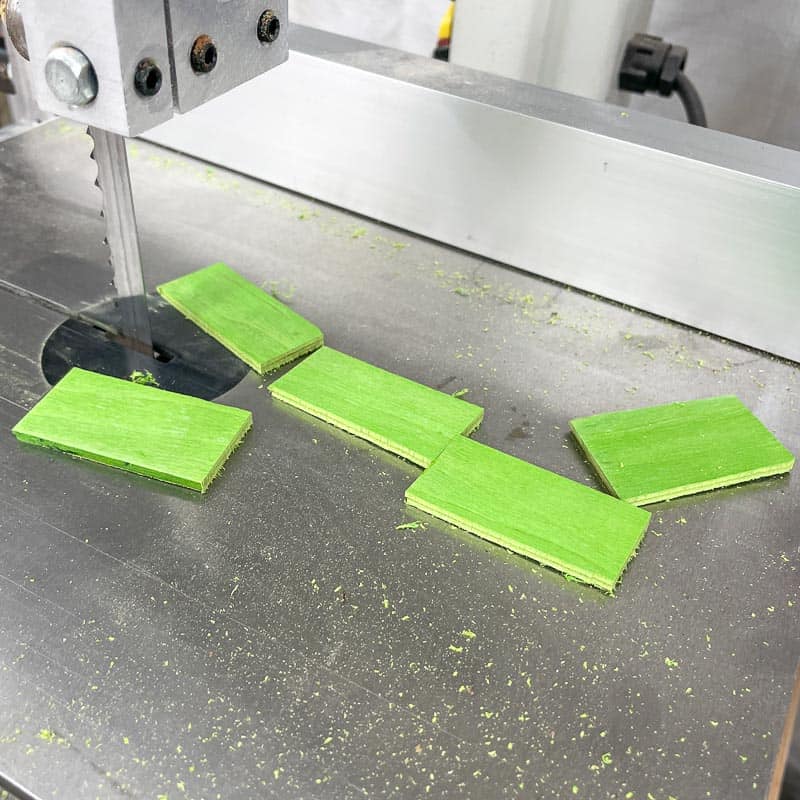 green veneer pieces cut to size at the band saw