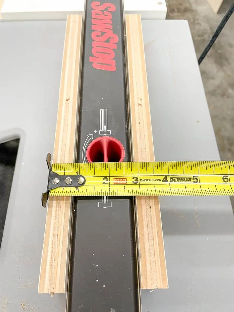 measuring width of table saw fence with side pieces for spline jig