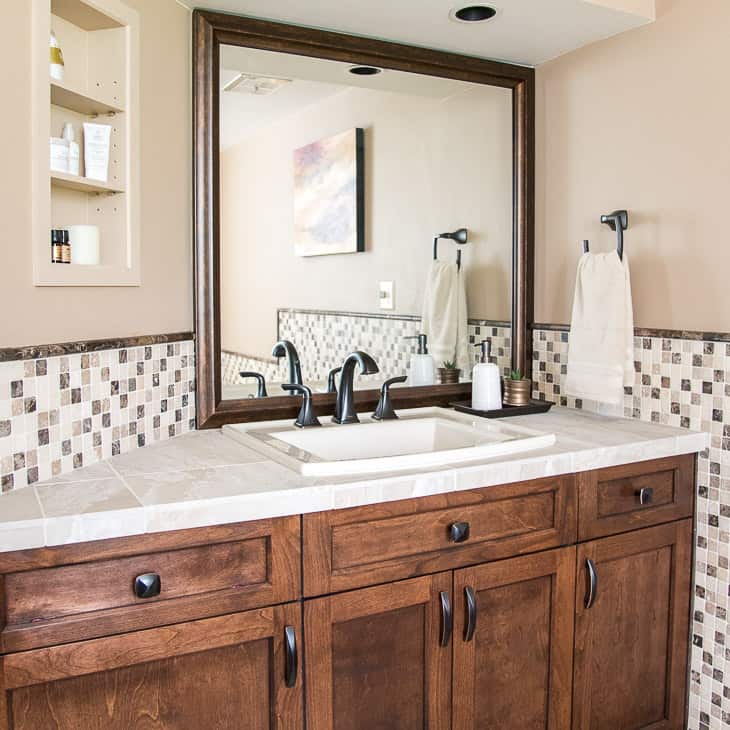 bathroom vanity with limestone tile countertop