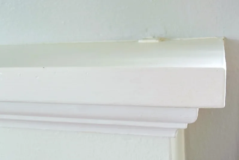 old fireplace mantel with exposed bracket