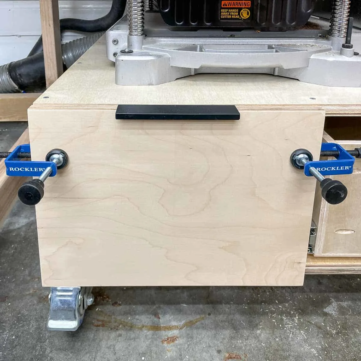 installing drawer front on drawer in planer stand with specialty clamps