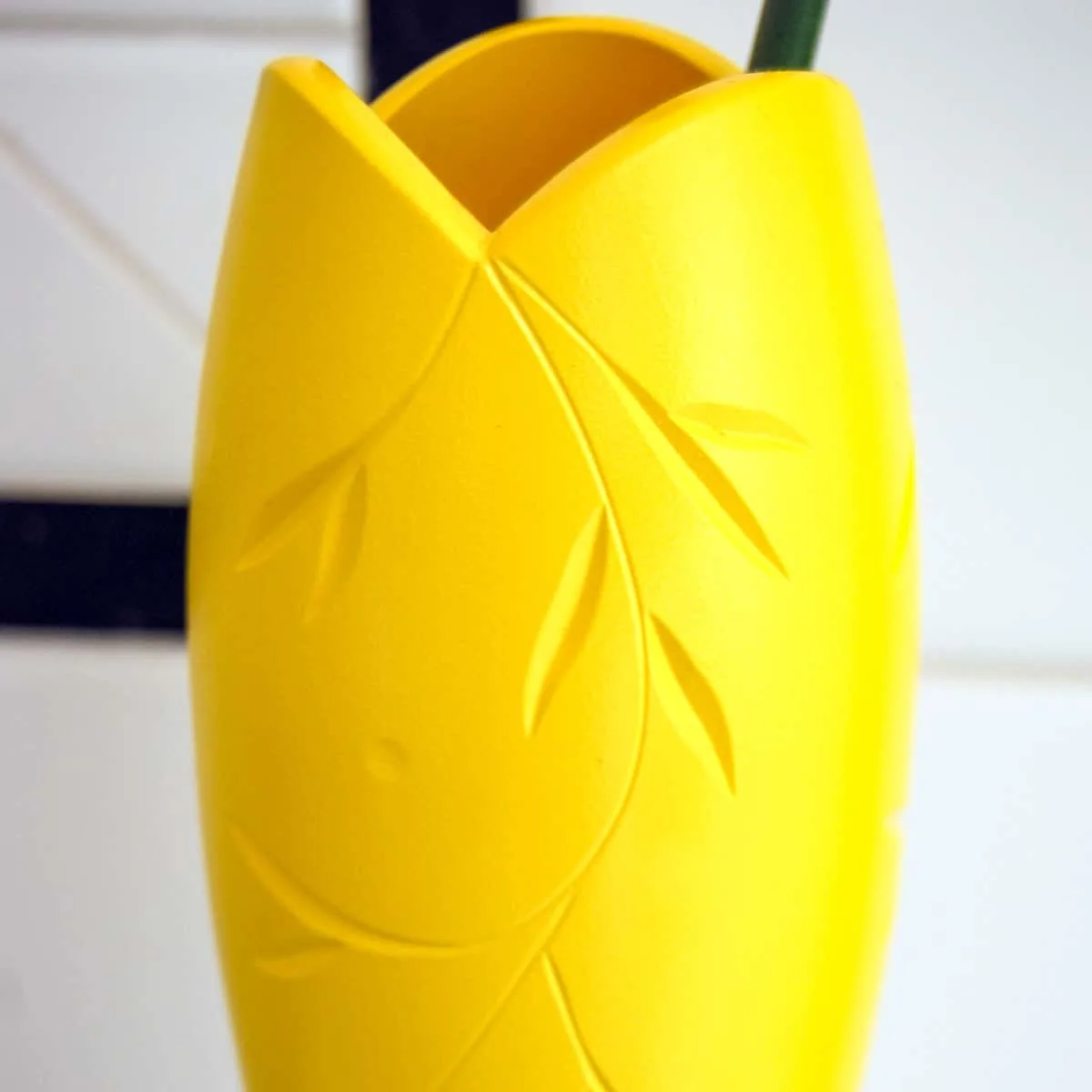 cut glass vase with deep facets spray painted yellow