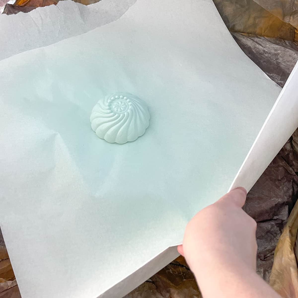 turning paper with painted glass on top to access the back side