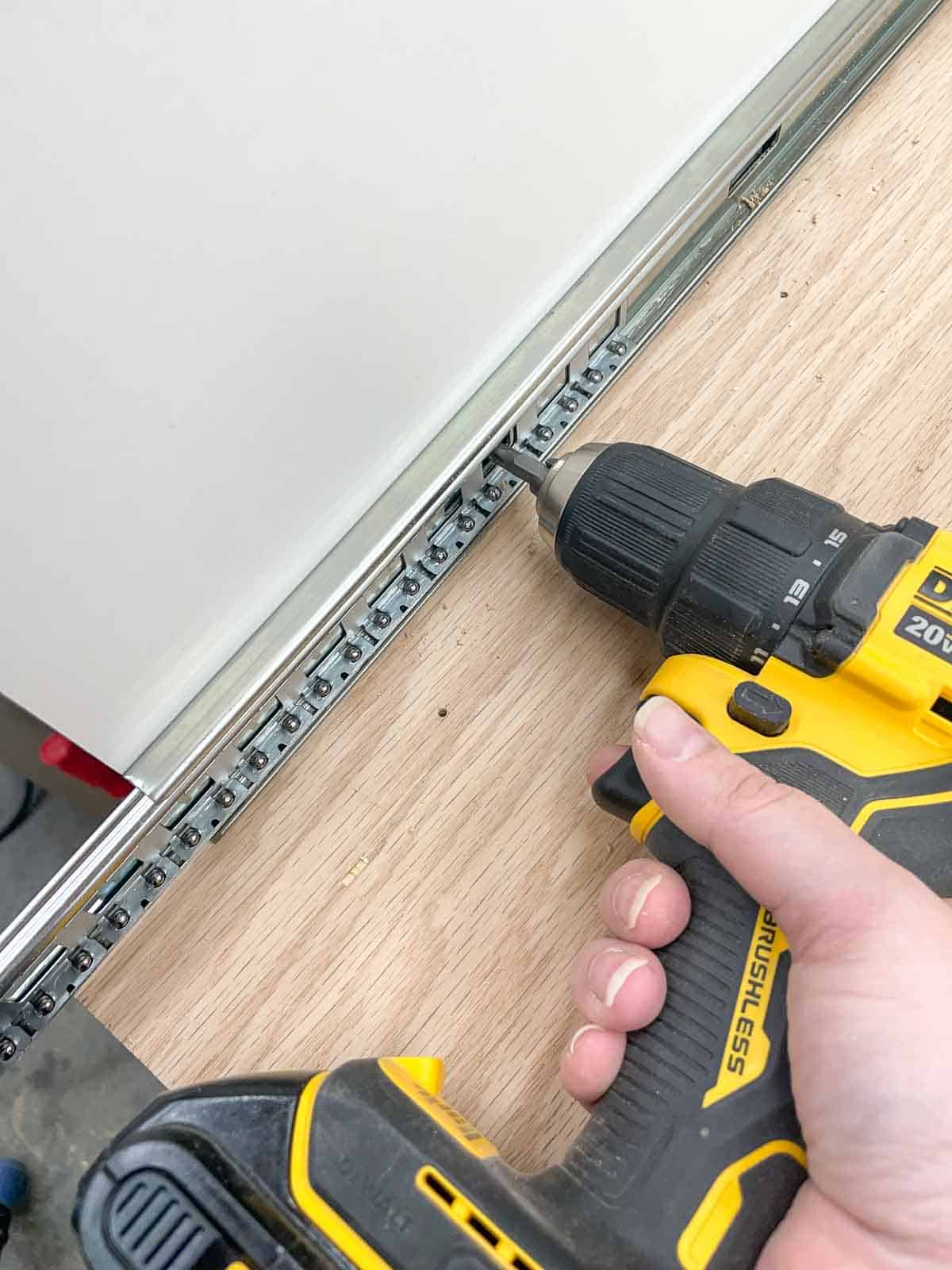 screwing drawer slides into planer stand sides