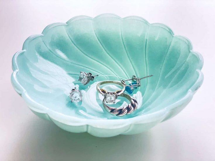 spray painted glass dish with jewelry