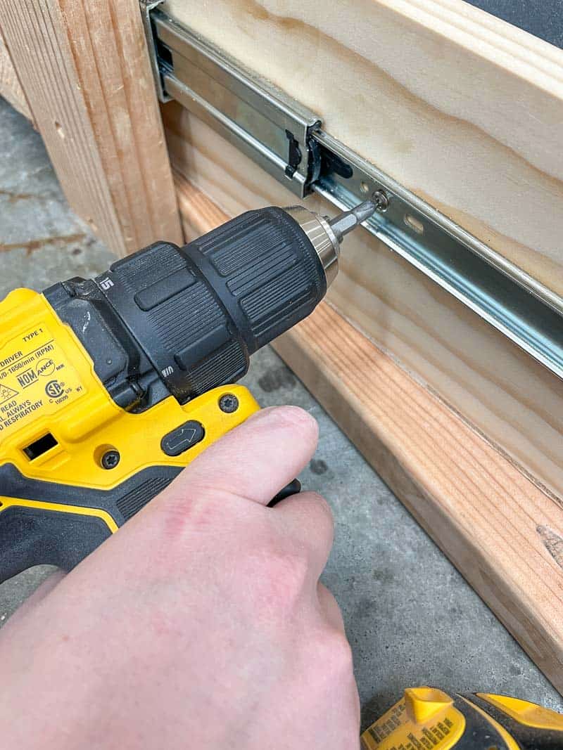 attaching drawer slide to drawer with a drill