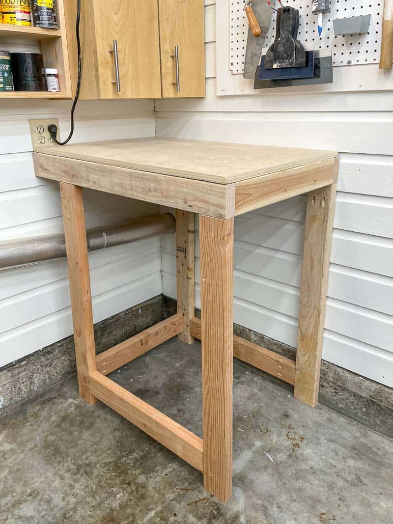 tool stand frame attached to wood paneled walls in workshop