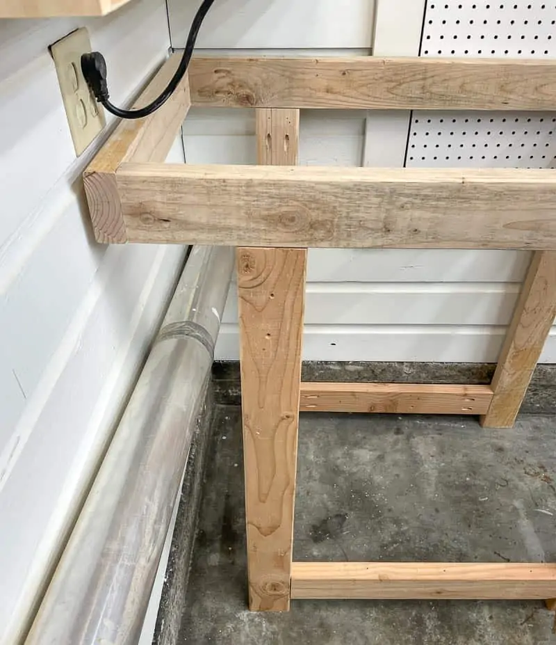 tool stand with overhang to accommodate dryer vent