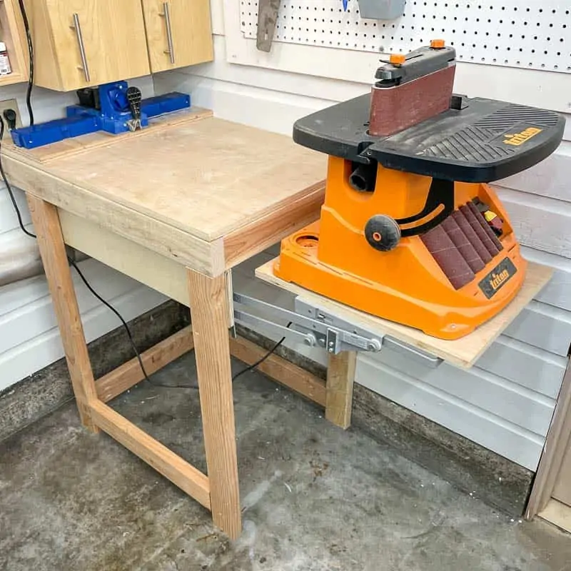 DIY tool stand with mixer lift for sander in raised position