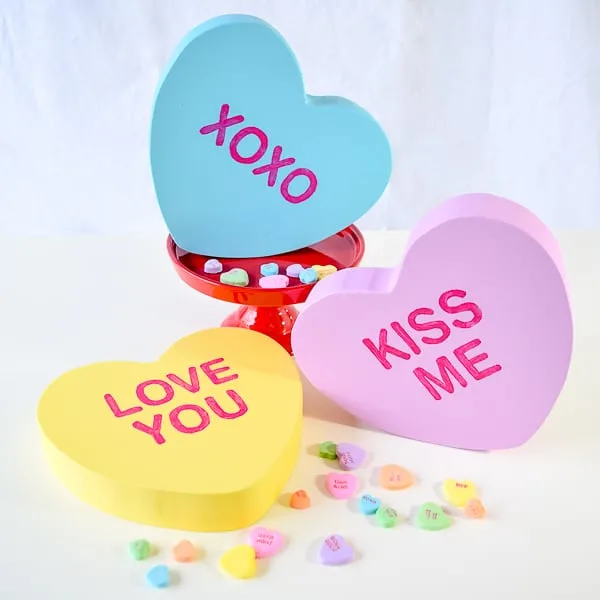 giant conversation hearts decor with candies sprinkled around