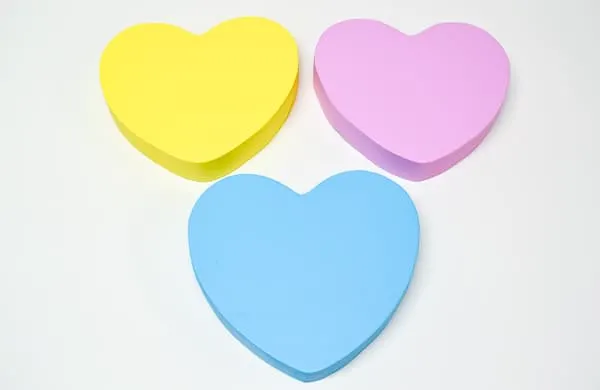 wooden hearts painted to match conversation hearts candies