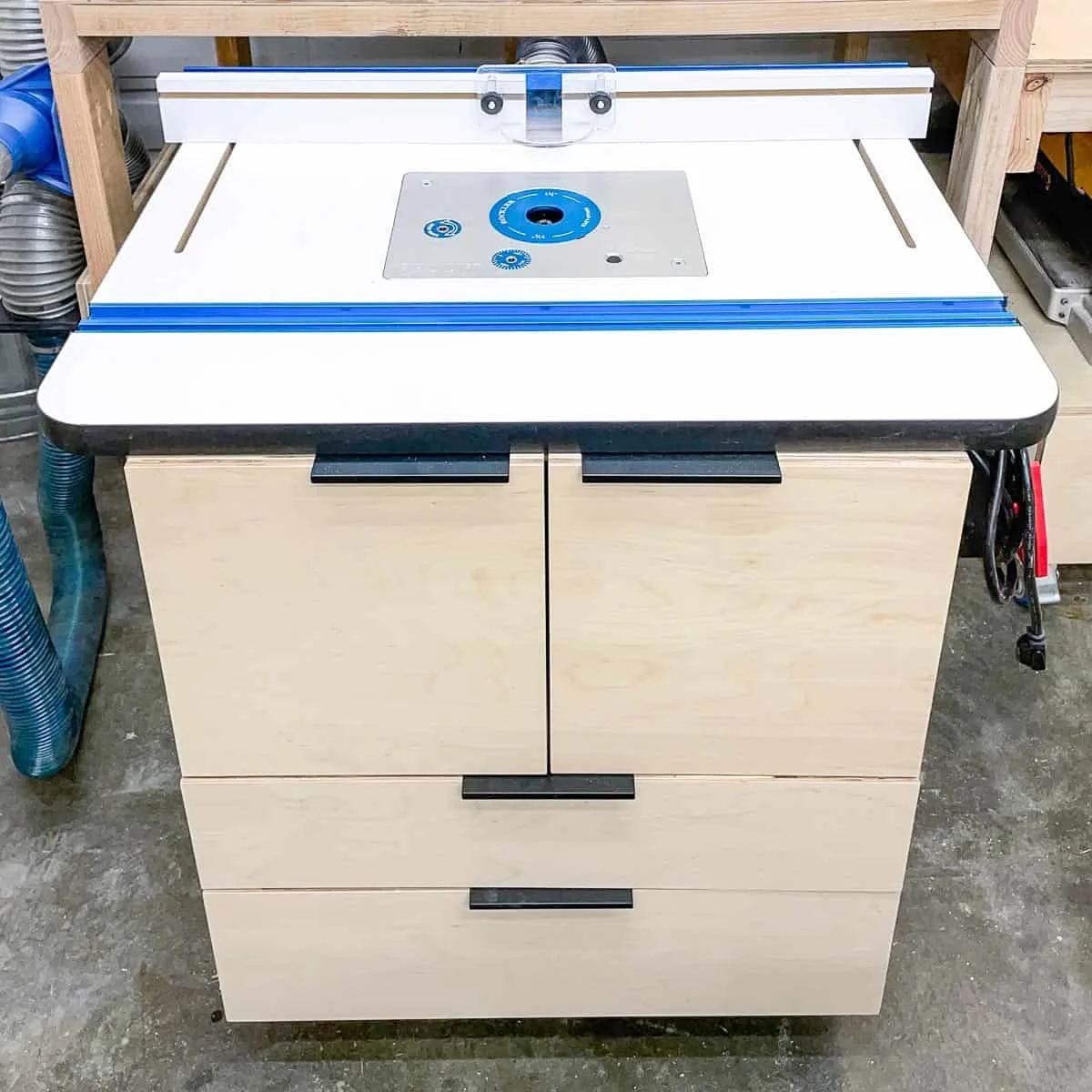DIY router table with cabinet doors and drawers