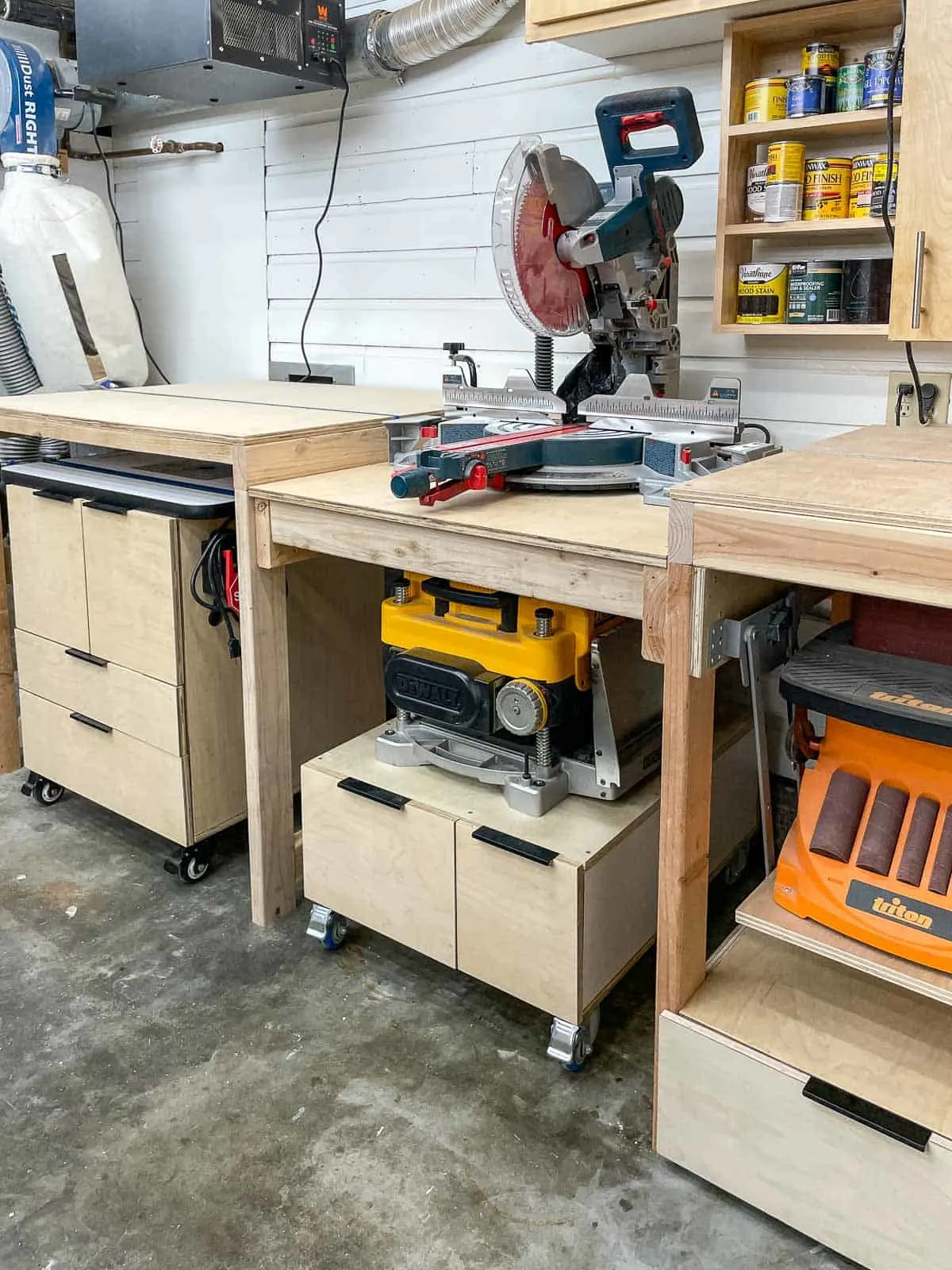 miter saw station with router table, planer stand, benchtop sander and lots of storage