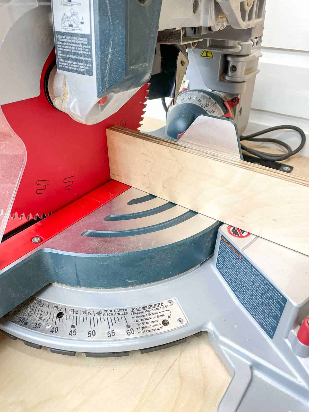 cutting the extension fence on the miter saw