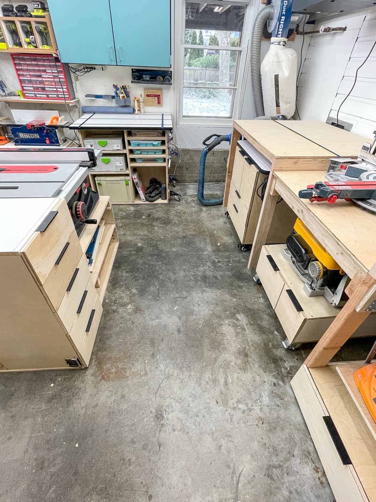 garage workshop with tools and dust collector in the corner