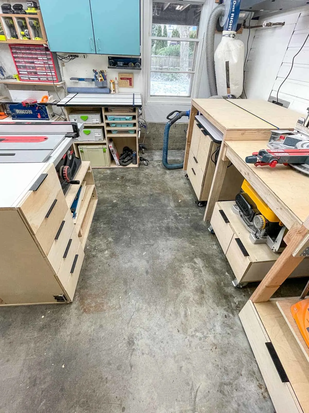 garage workshop with tools and dust collector in the corner