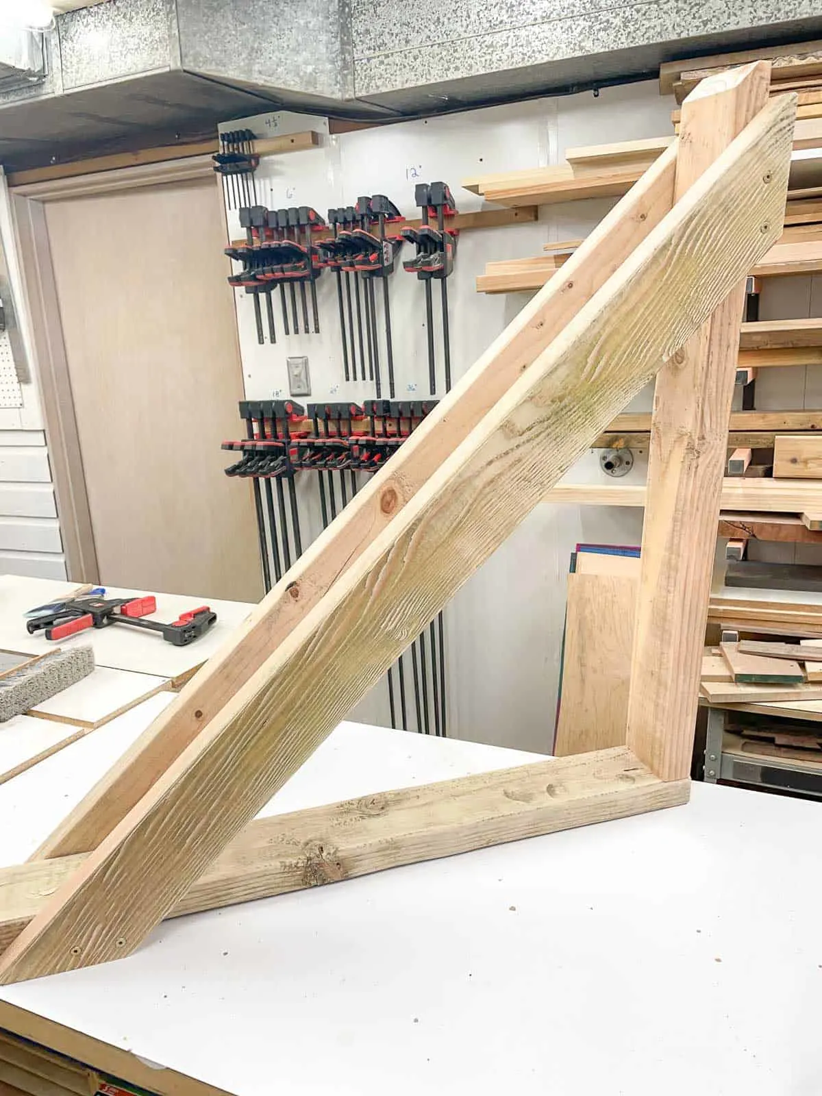 DIY wood bike rack assembled on workbench
