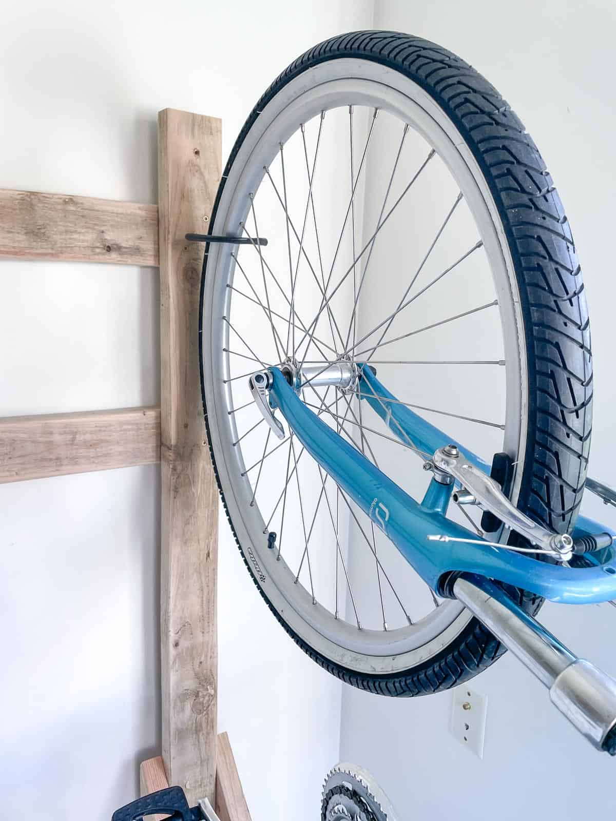 2x4 bike rack with wheel on hook