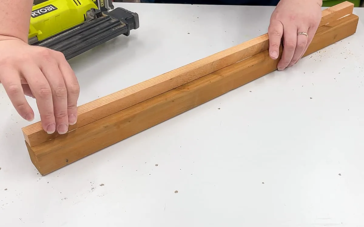 aligning the cleat on the side of the mini greenhouse shelf piece