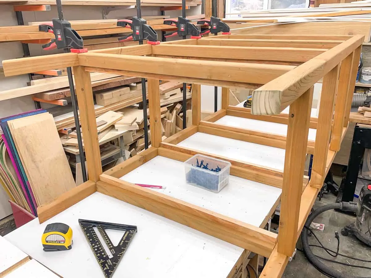 DIY mini greenhouse frame assembled on workbench