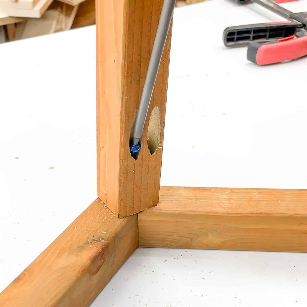 attaching the two angled roof pieces together with pocket hole screws