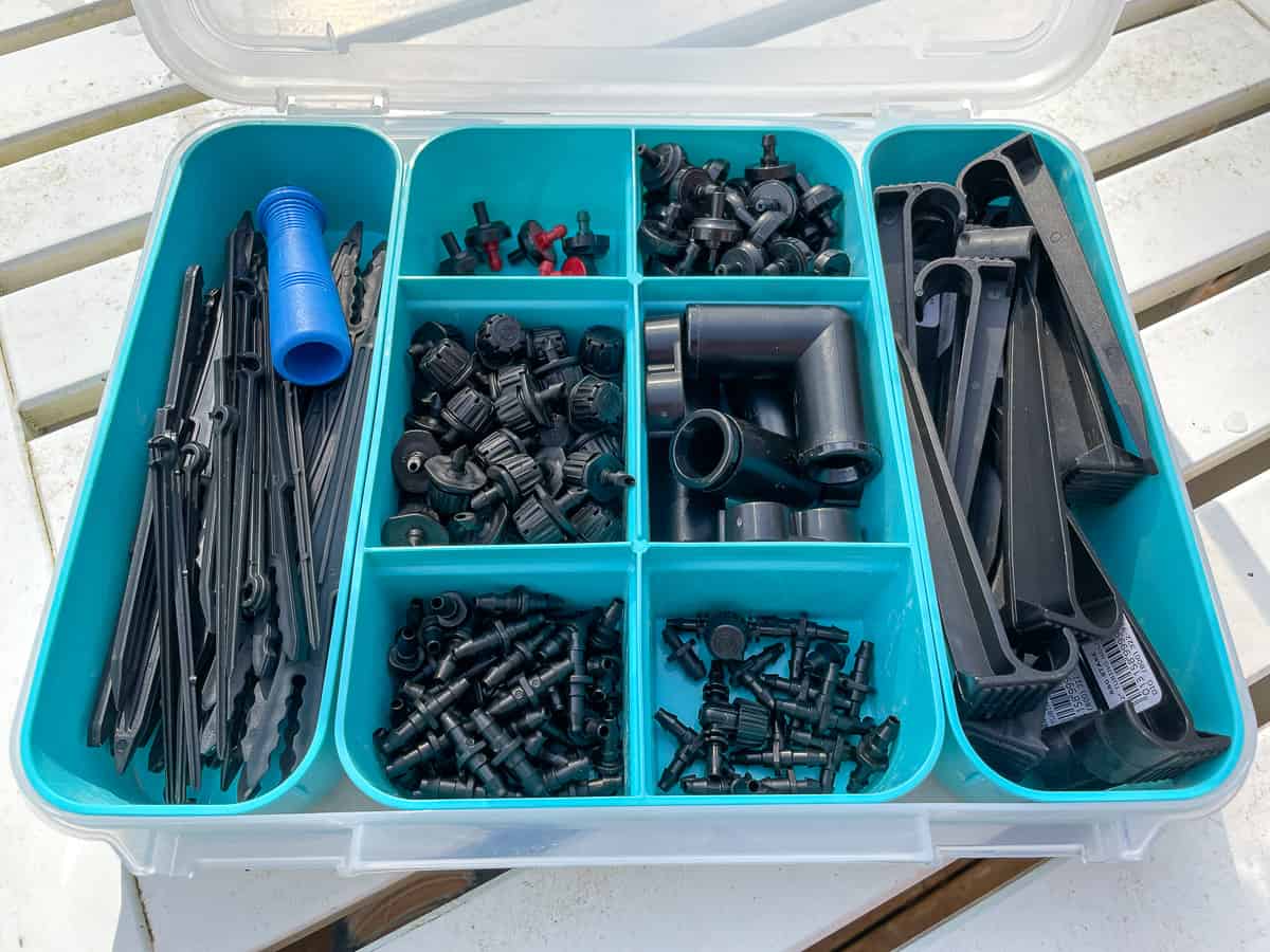 drip irrigation components organized in plastic parts organizer