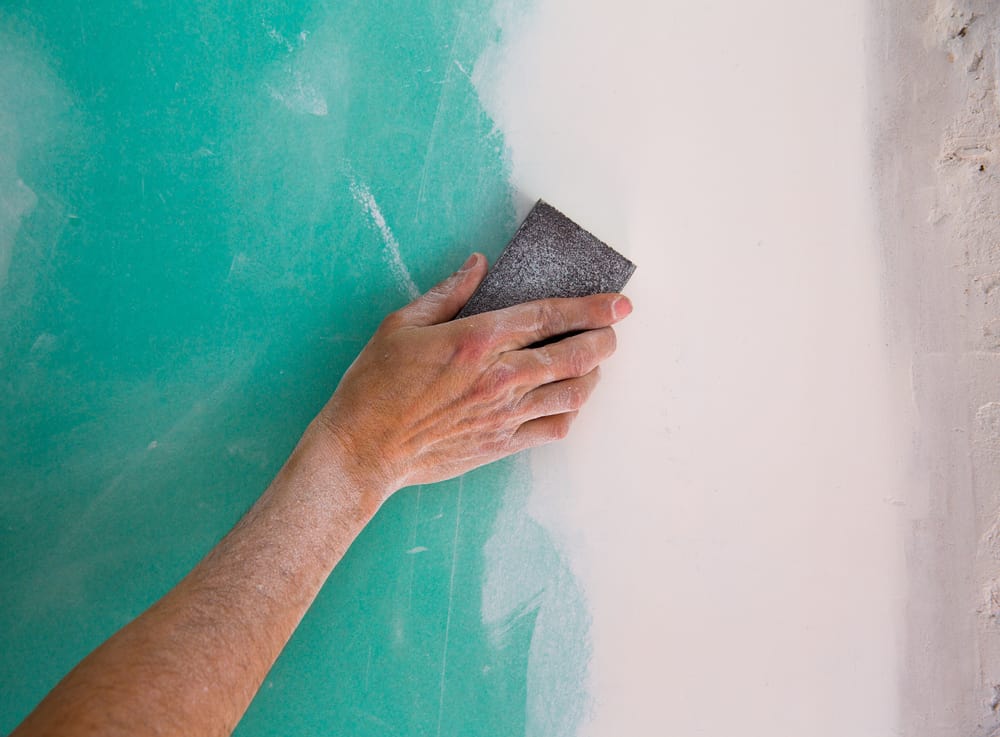 sanding drywall seam with sanding block