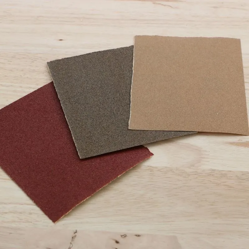 red, brown and tan squares of sandpaper