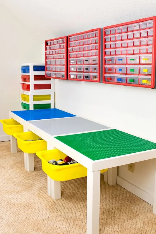 DIY Lego table with drawers open and wall mounted small parts bins above