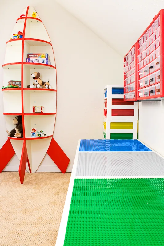 DIY Lego tables against the wall with rocket bookshelf in the background