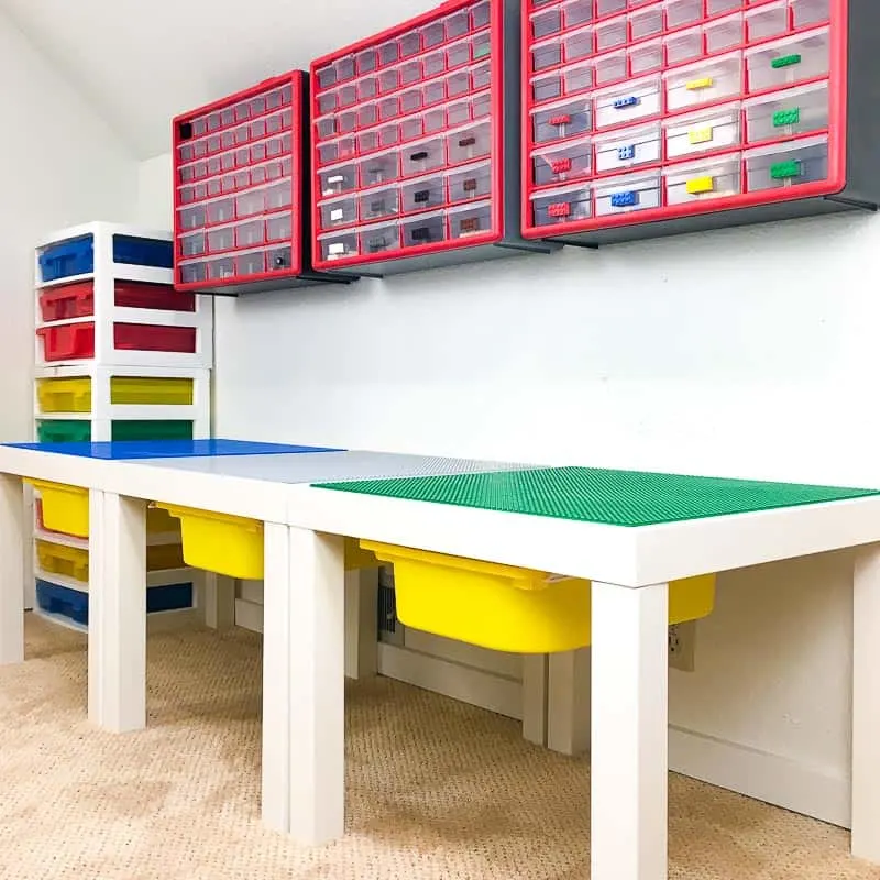three Lego tables connected with Velcro with part storage above