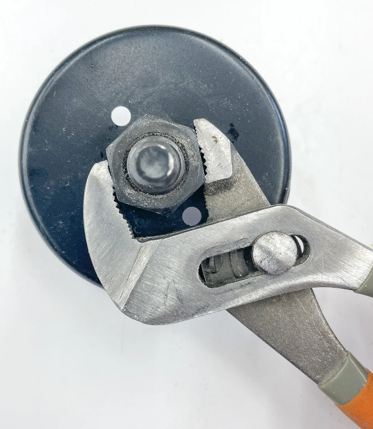 tightening hole saw nut with an adjustable wrench