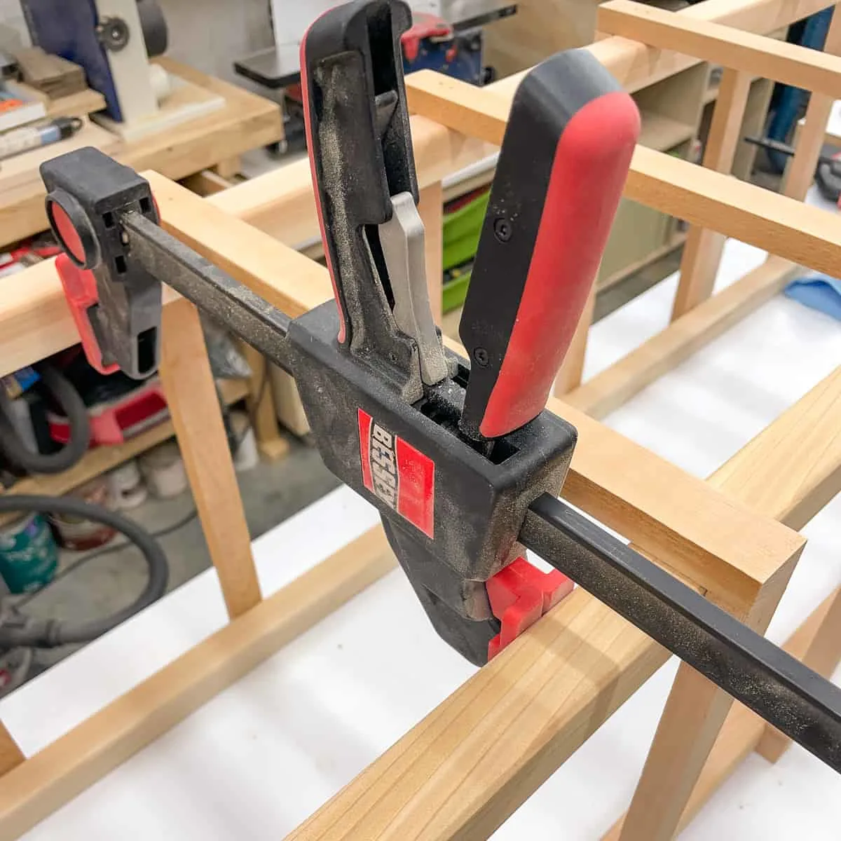 Bessey quick clamps acting as a spreader to align the slats of the wood tomato cage