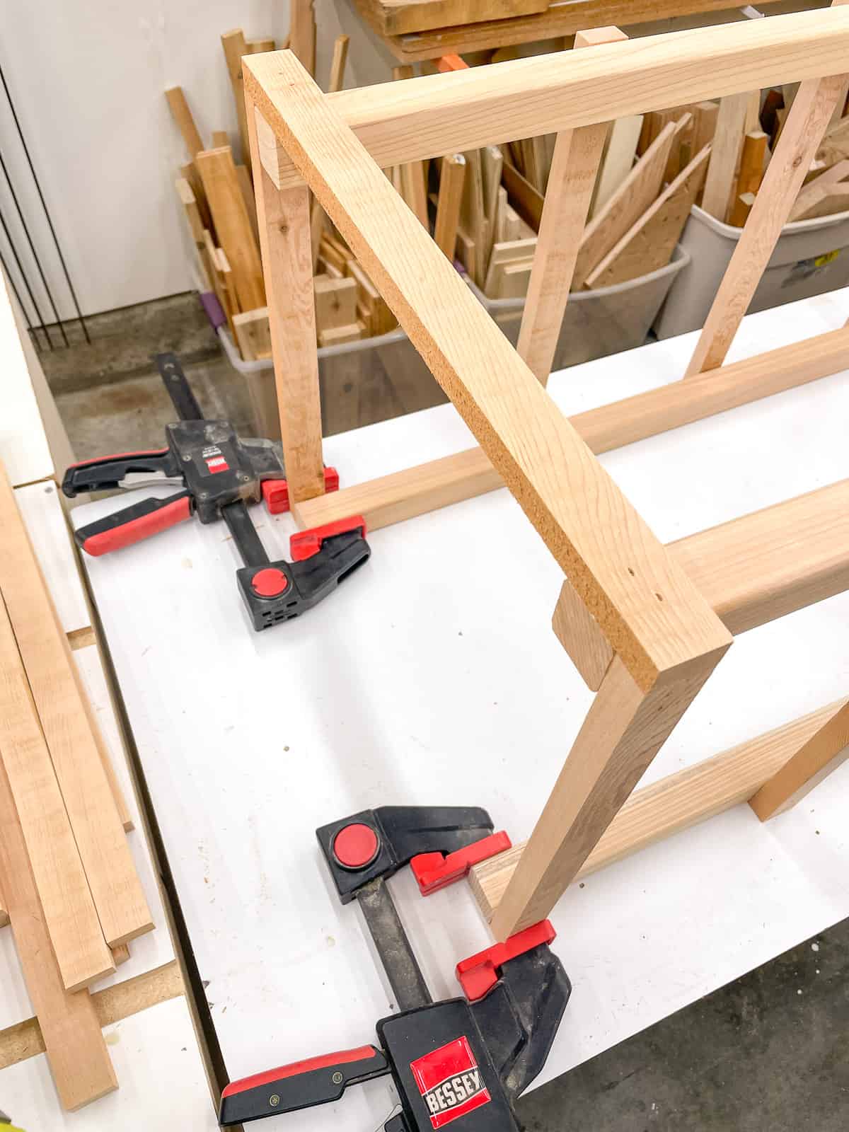 clamps holding sides of tomato cage upright during assembly