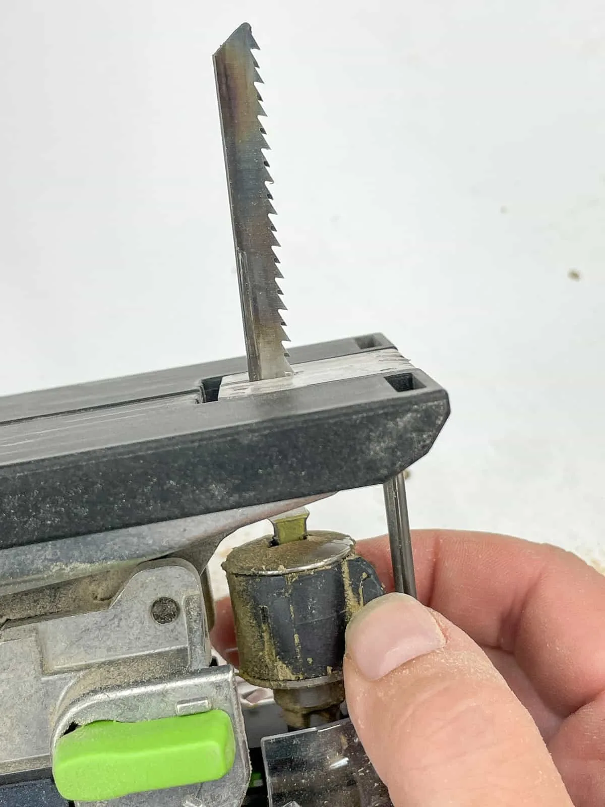 insert the jigsaw blade by twisting the blade clamp lock