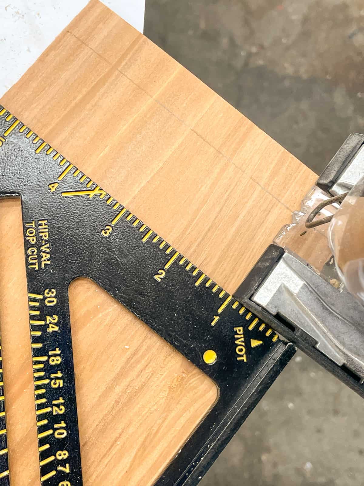using a speed square to make a straight cut with a jigsaw