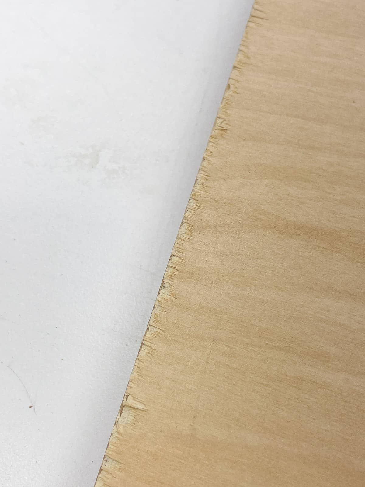 tear out along edge of plywood board from a jigsaw blade