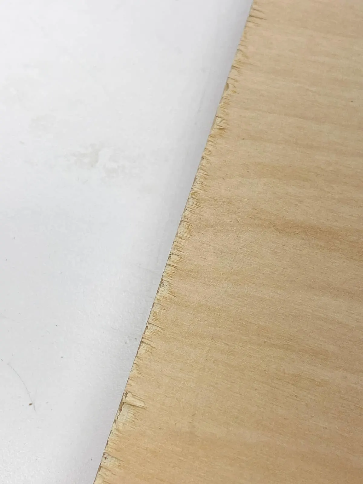 tear out along edge of plywood board from a jigsaw blade