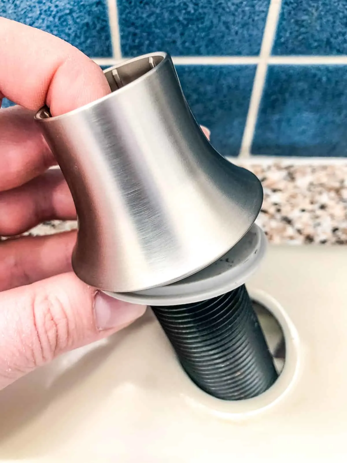 kitchen sink soap dispenser escutcheon and gasket over hole in sink