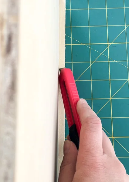 trimming sides of edge banding with a utility knife