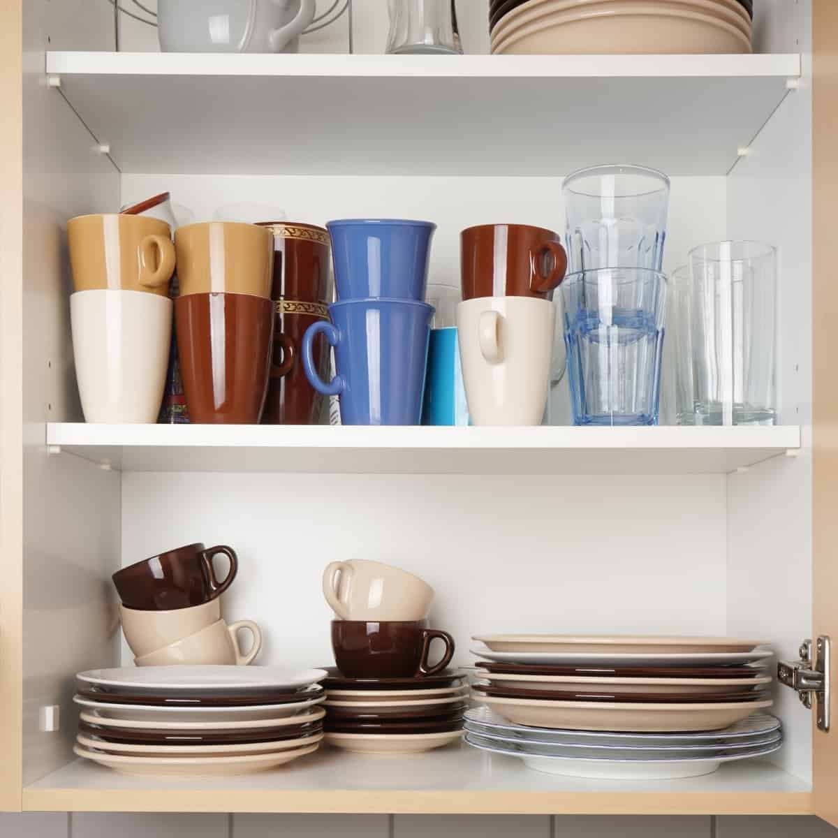 frameless cabinet with dishes on shelves