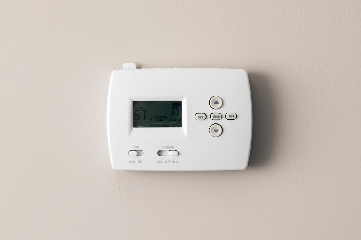 thermostat with dim screen on the wall