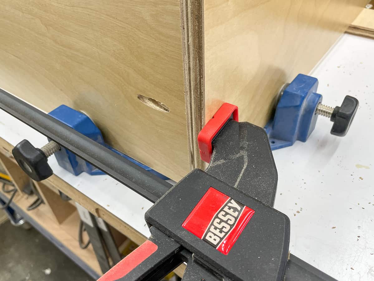 corner of cabinet box clamped together